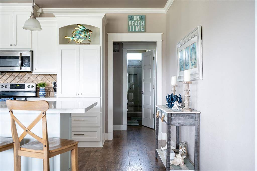 Off the kitchen are the two secondary bedrooms and secondary bathroom.