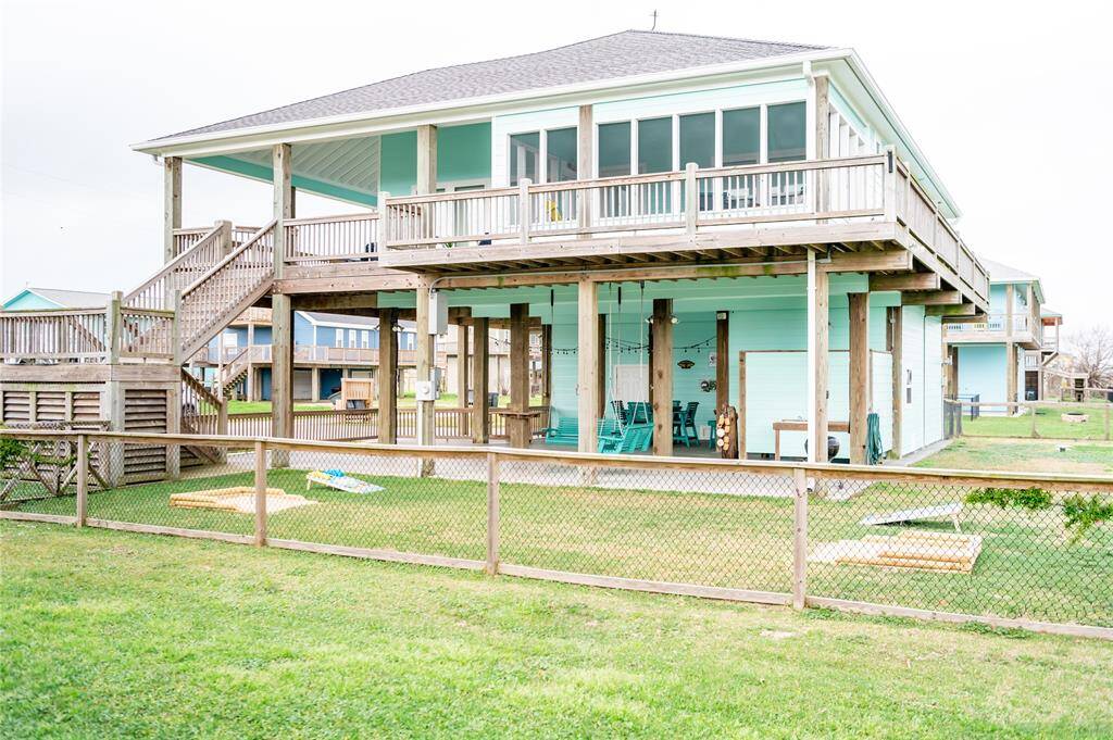 With a wraparound porch and a fully fenced in yard, this house has all the extras you crave in a beach home!