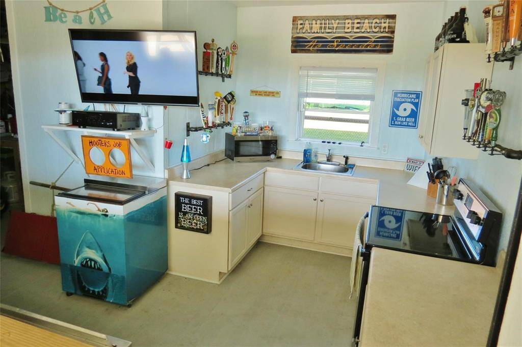 The downstairs FULL kitchen with a roll up bar window is an entertainer's dream!