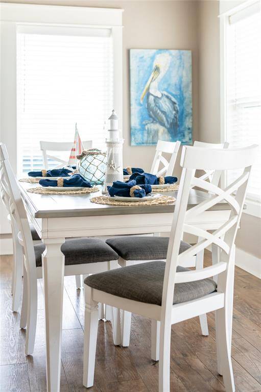 The dining area is located right off the kitchen for easy entertaining! Furniture included!