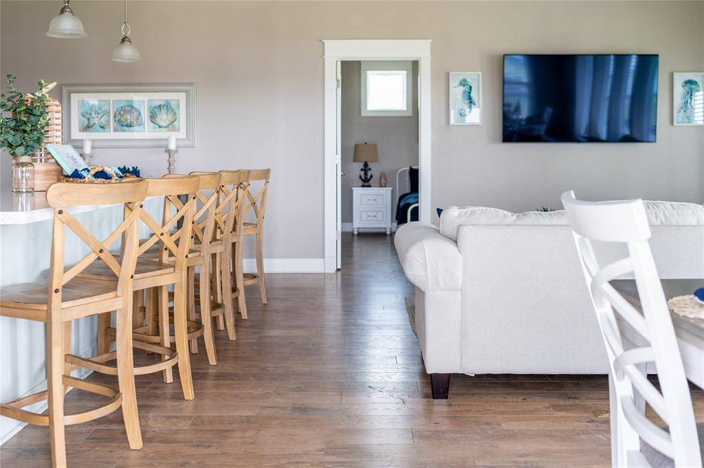 The primary suite is located off of the living room!