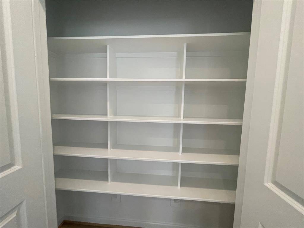 fExtra shelving was added in lieu of a tub in the Primary bedroom.