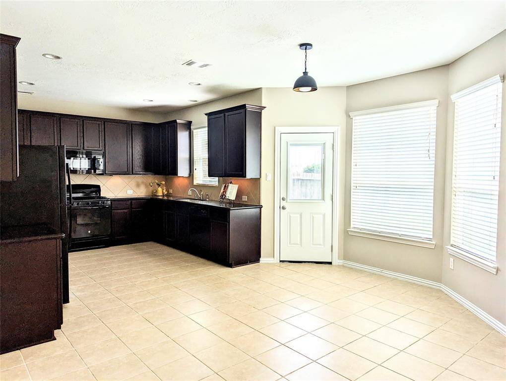 Breakfast area with access to backyard patio.