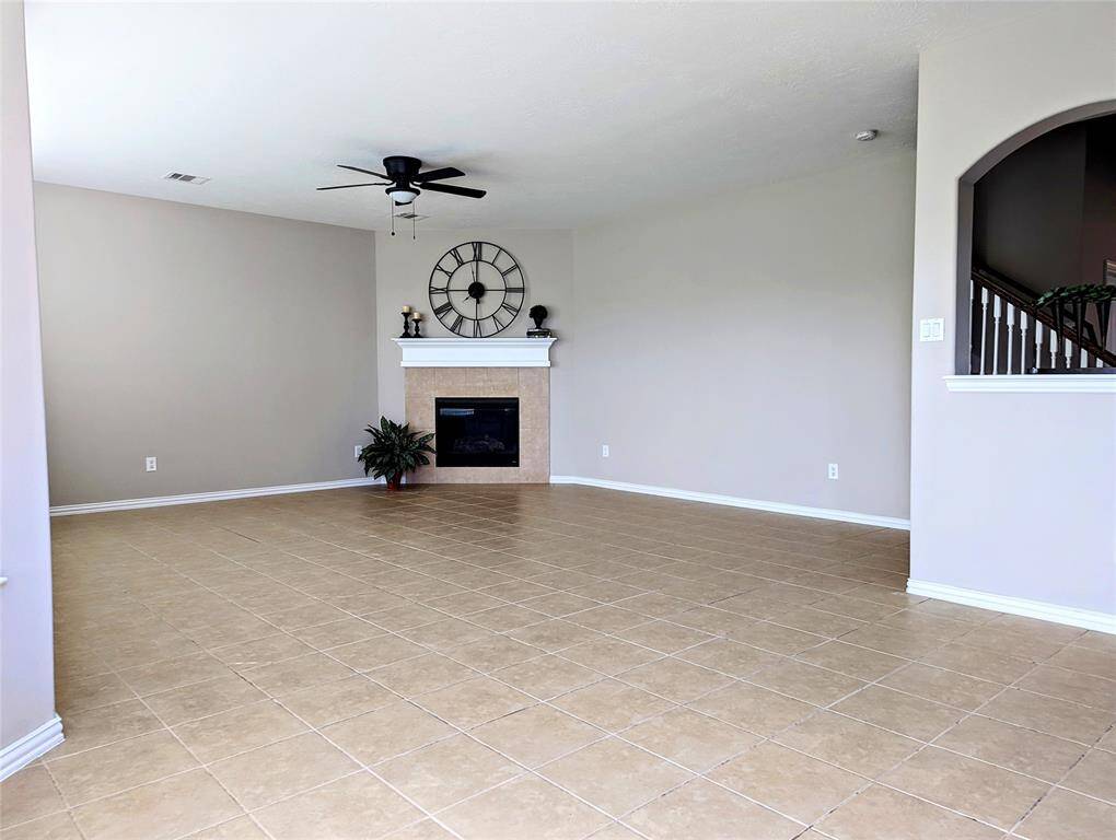Large family room with gas fireplace.
