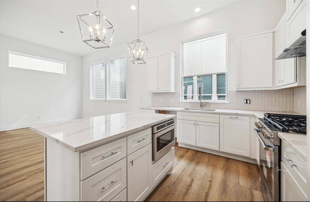 The kitchen and this beautiful Amy plan is open to the living and dining area. It’s a great home for spending time with your family or entertaining friends.