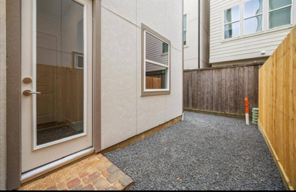 A spacious back area to enjoy with your family and furry friends. It’s a perfect size for a table and some chairs and for grilling up some good food.