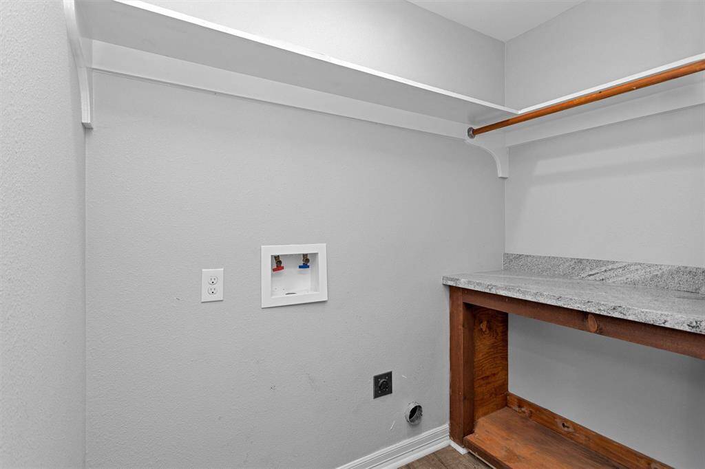Large utility room inside the home, with a convenient folding table built in