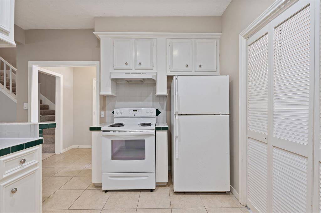 FRIDGE is INCLUDED.  Notice the FOLDING DOORS that allow you to close off the Laundry Room...
