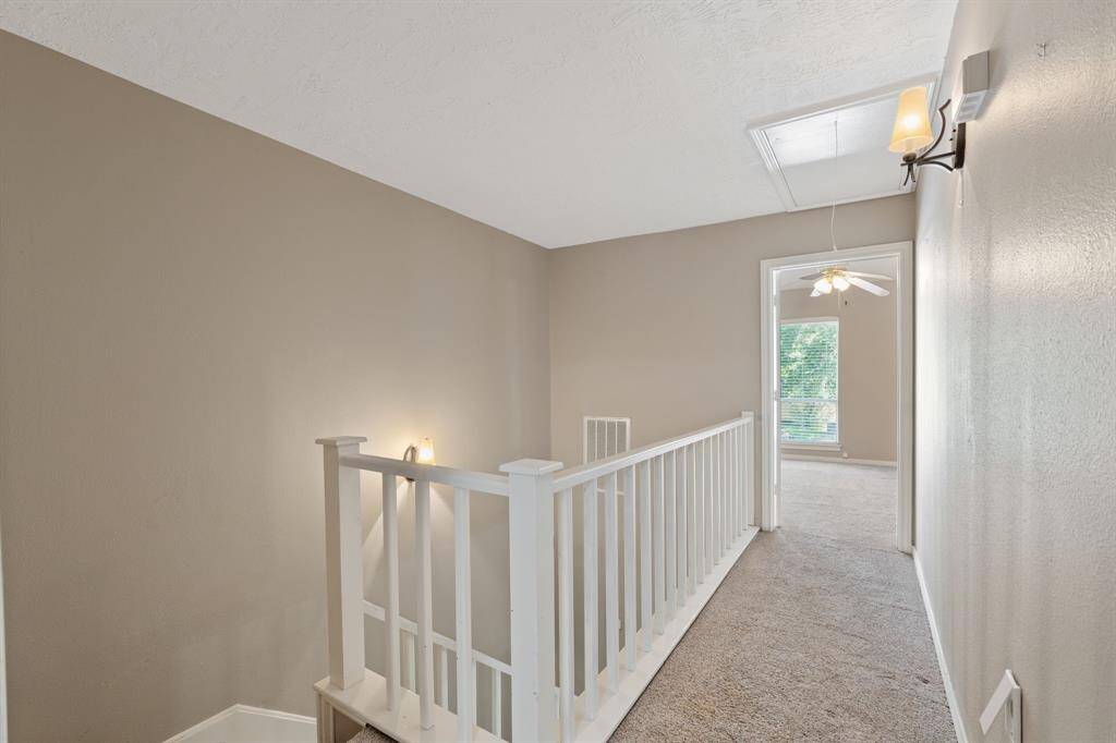 Looking from a Bedroom down the hallway to the other Bedroom
