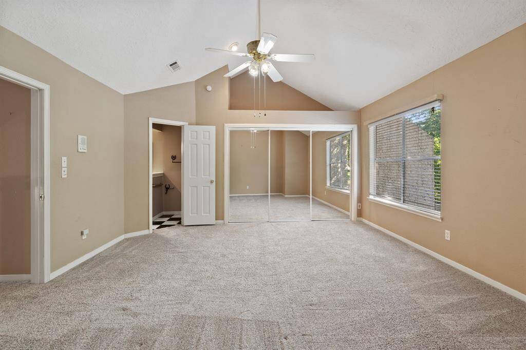 Bedroom at the top of the stairs has a VAULTED CEILING + a great LEDGE for decorating (or storage).  The large window gives you a BEAUTIFUL VIEW of the nature filled area across the street!