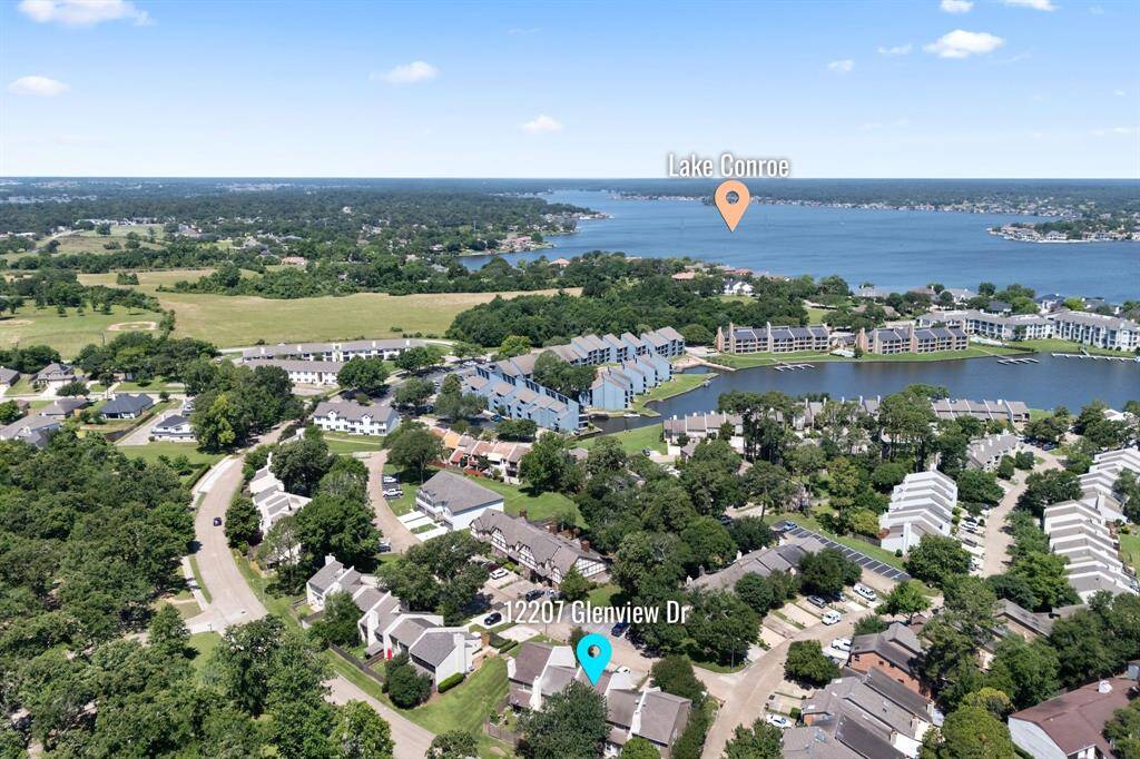 Aerial view of this fabulous Townhome with Lake Conroe a couple of minutes away!