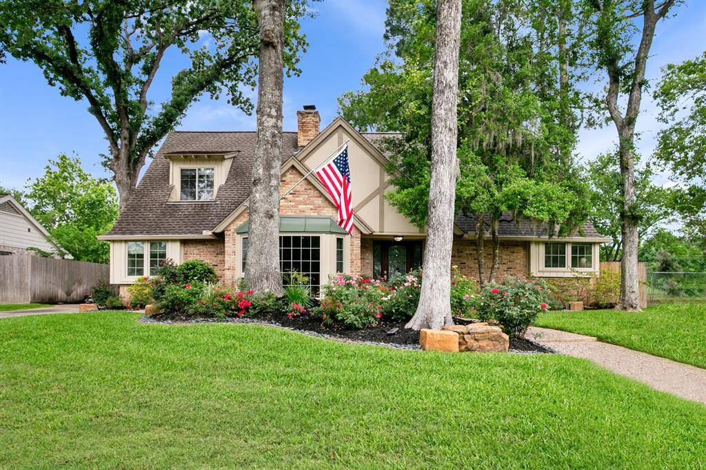 Timeless 4 bedroom home with pool idyllically situated on what is arguably one of the prettiest streets in West Houston, 12322 Lanny Lane!