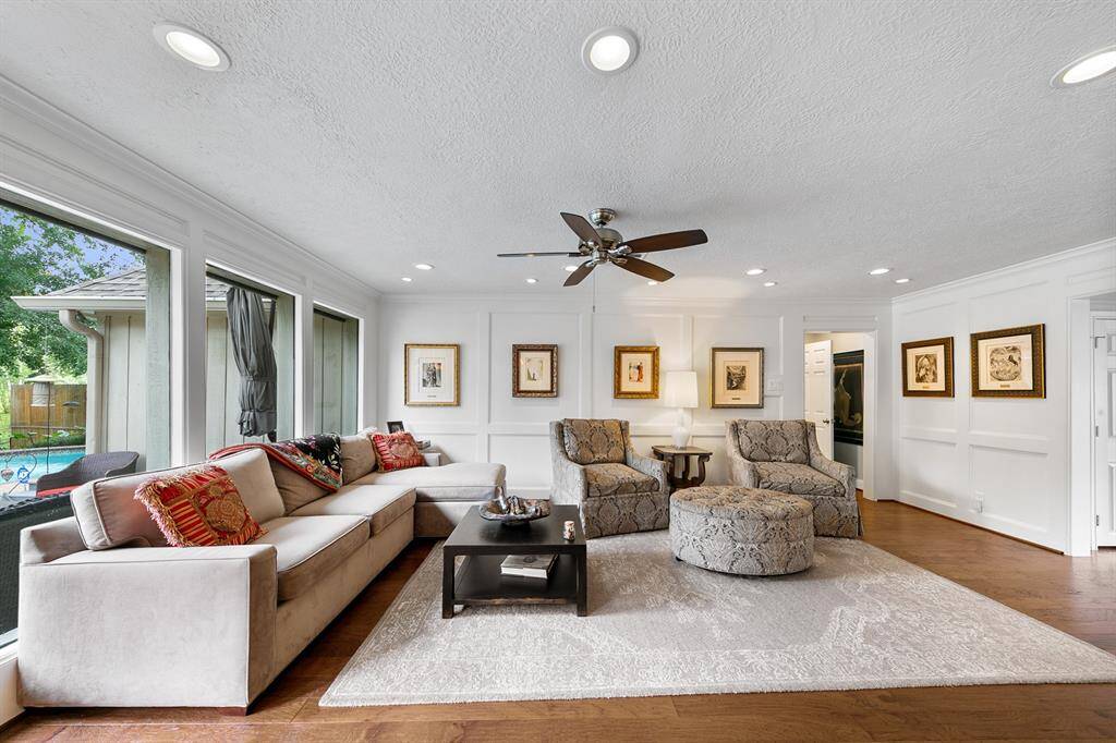 The Family Room is California fresh with a bank of windows overlooking the pool, hardwoods and neutral paints.