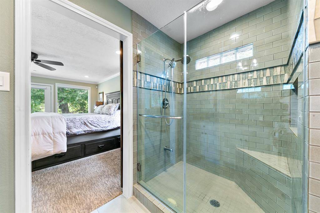 Peaceful colors, along with carefully selected shower tiles, shower bench and rainfall shower head for an amazing spa-like experience.
