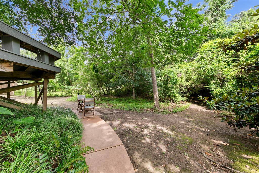 Lower level of the lot offers endless possibilities and at one time housed a trampoline and a playhouse.