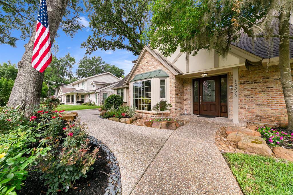 Path from street to the front door connects to the driveway. Front door is protected from the weather by an overhang.