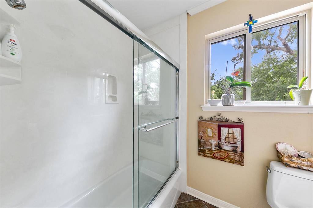 Second floor bath with glass door.