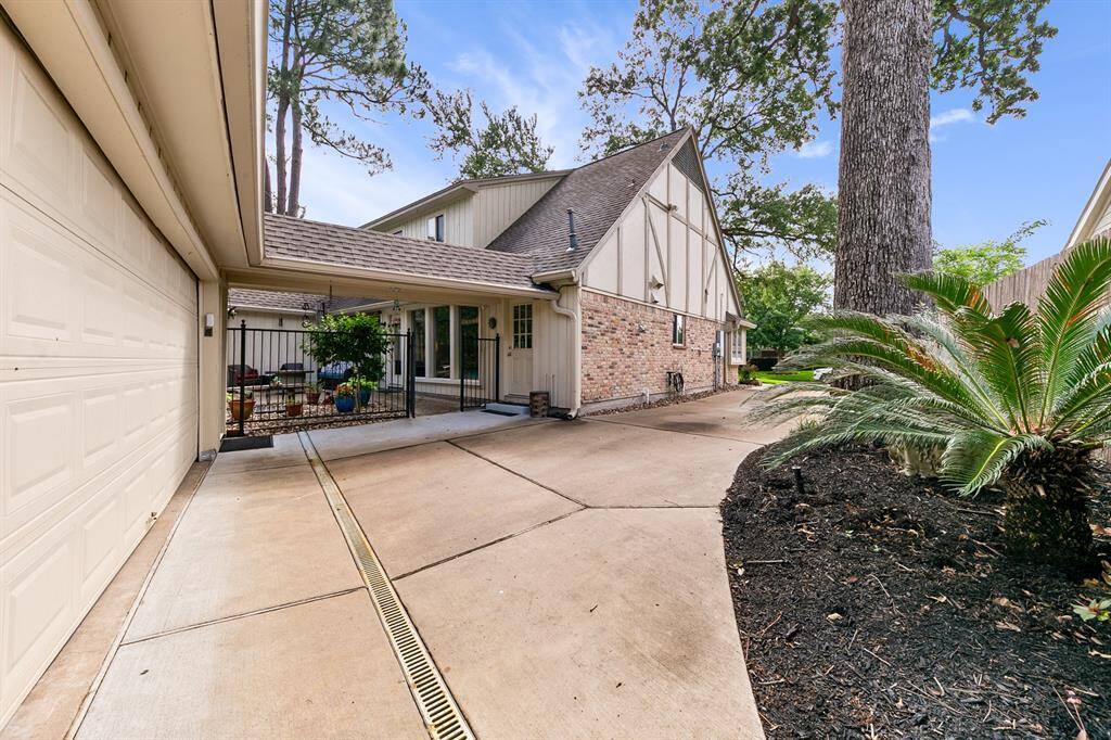 Driveway replaced in 2018 and drains added that flow to the street. Covered walkway from the house to the garage.
