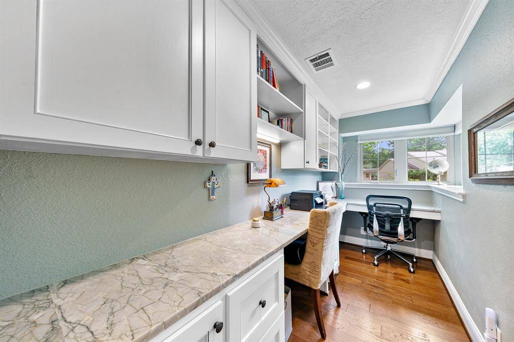 Working at home never looked so beautiful!  Sellers have cleverly crafted this workspace to accommodate two people with plenty of surface space and storage.