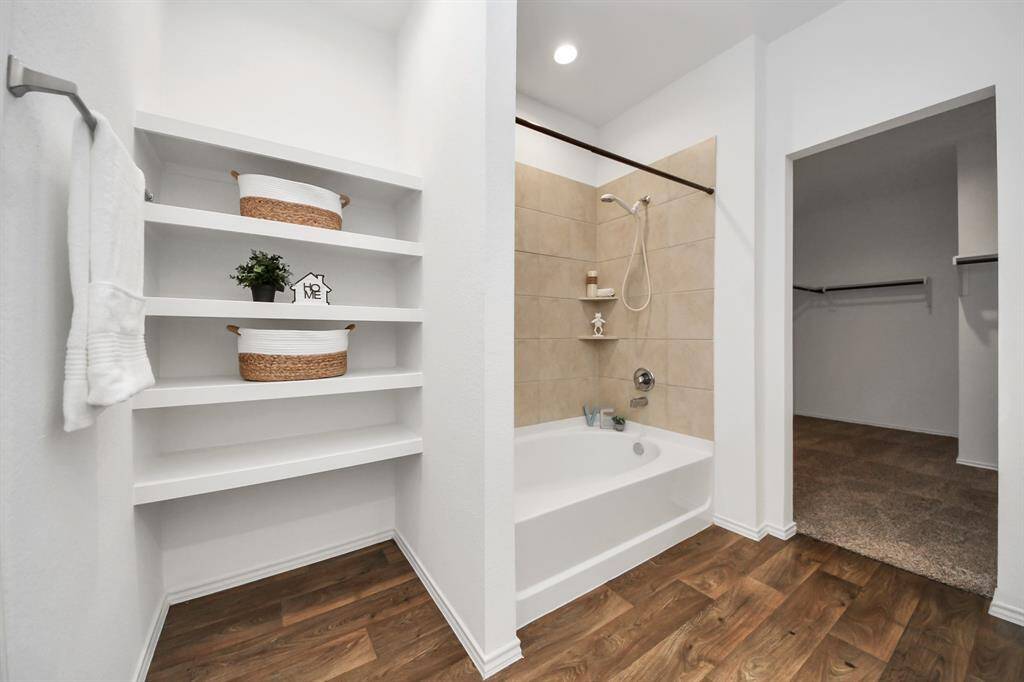 The primary bedroom walk-in closet has excellent space, and closed circuit cameras convey with the property.