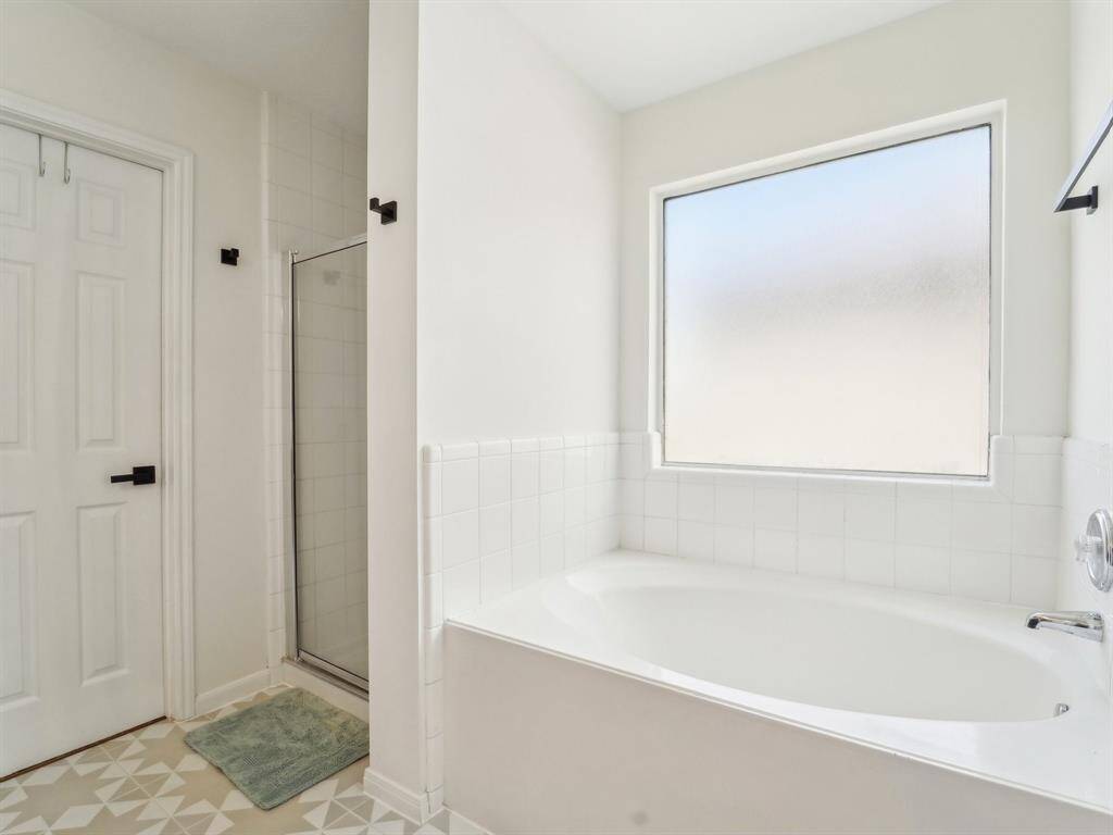 There is a garden tub and separate shower.