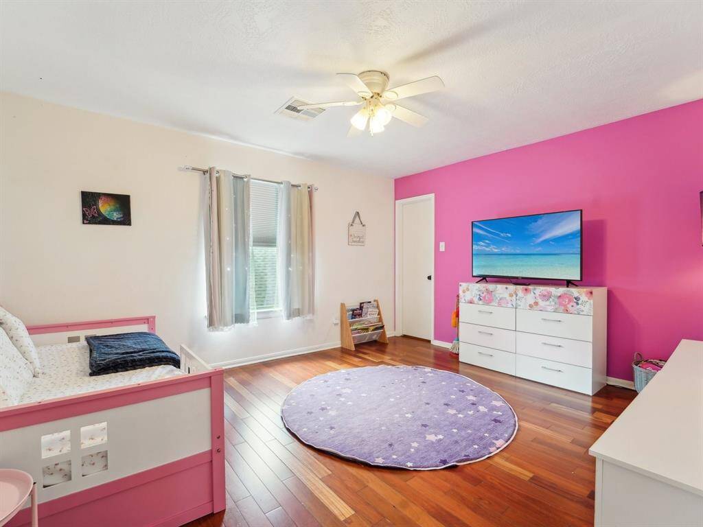 Bedroom 3 has a generous walk-in closet and pretty, accent wall.