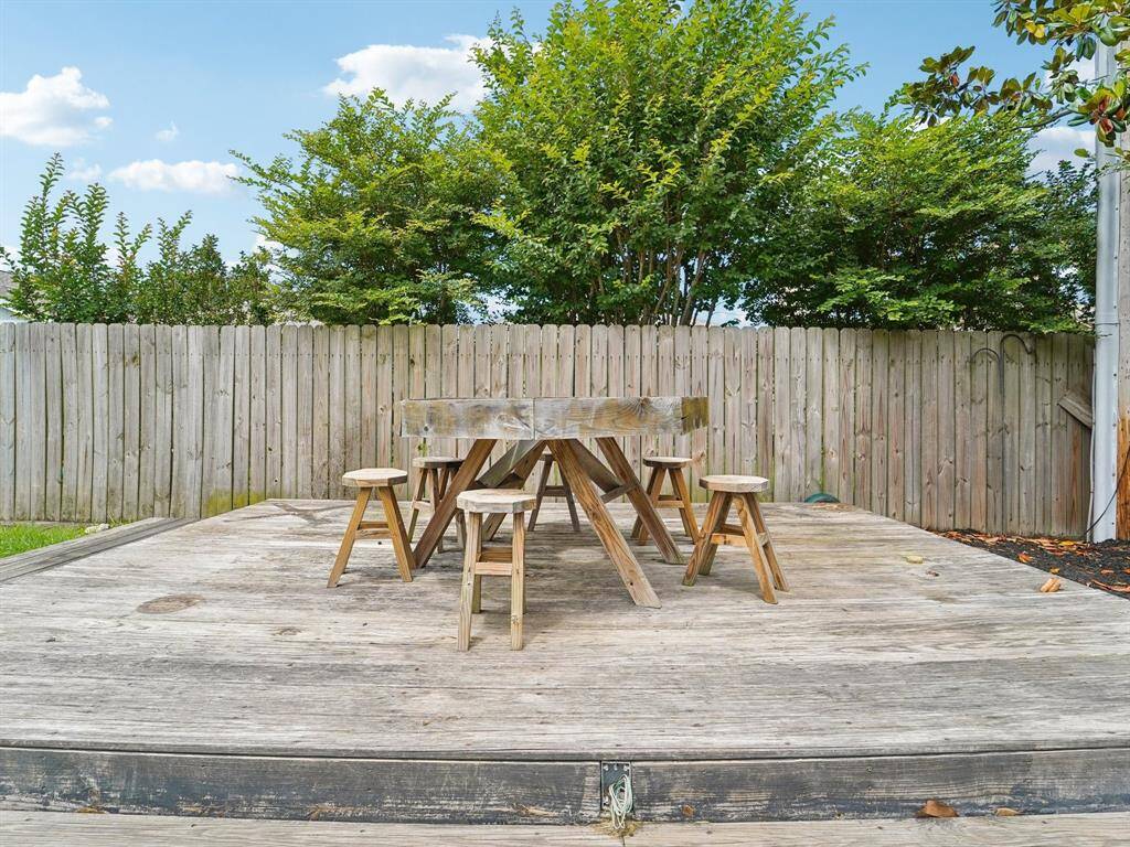 Imagine the cool outdoor BBQ's you'll have on this huge wood deck.