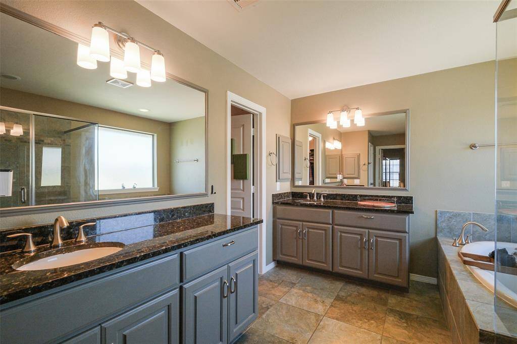 The primary bath is a great place to relax and unwind.