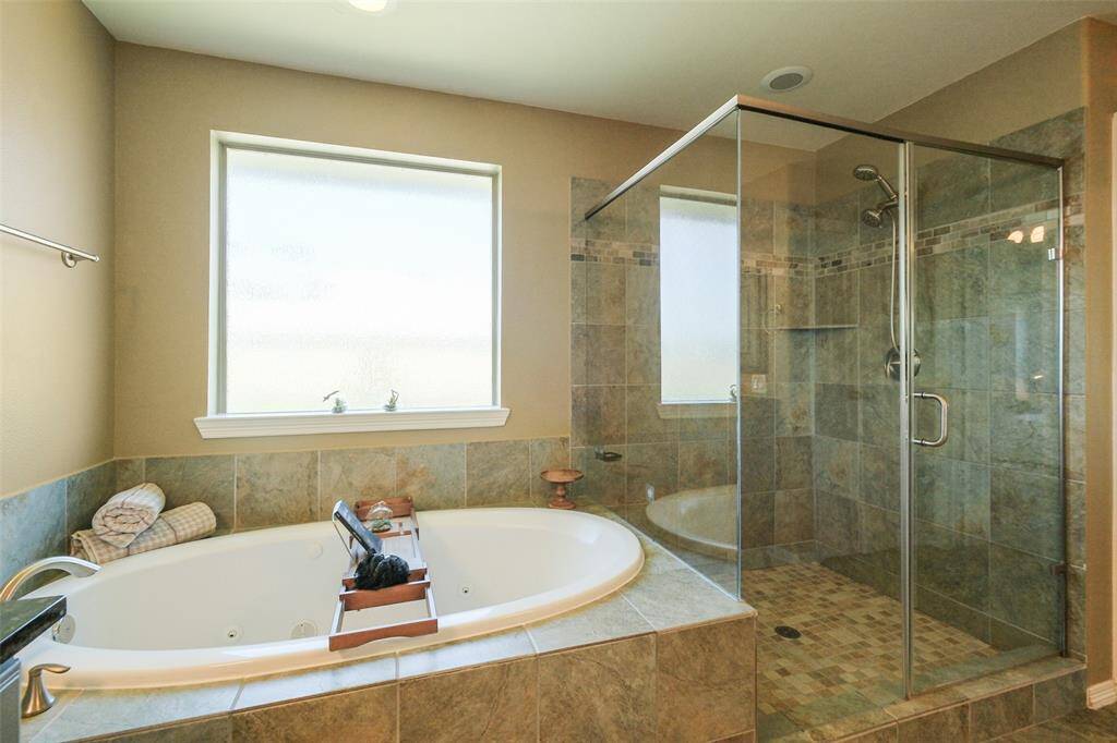 Soaking tub and stand alone shower.