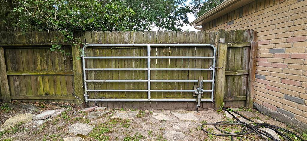 This is the gate on the right side of home that leads to a gigantic area you can store a trailer, small boat or other outdoor items you would usually need a storage lot for!