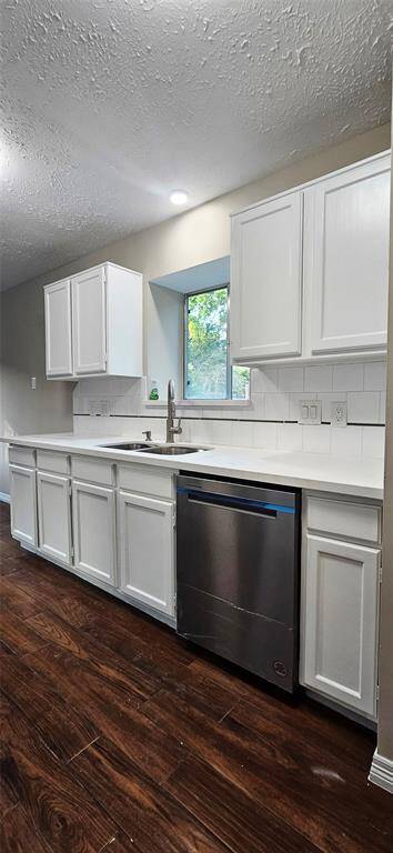 Kitchen is slightly open to Den with Quartz Counters, New D/W, and Microwave. Deep SS Sink and Brush Nichol pull down Faucet.