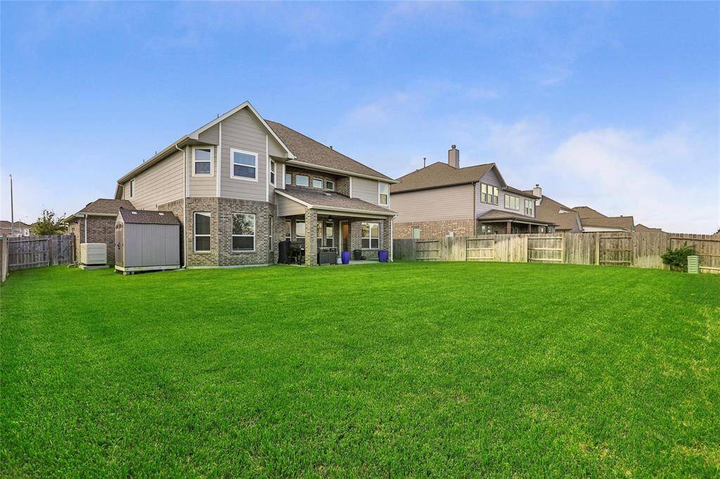 Large backyard perfect for entertaining. There's plenty of space to add a pool!