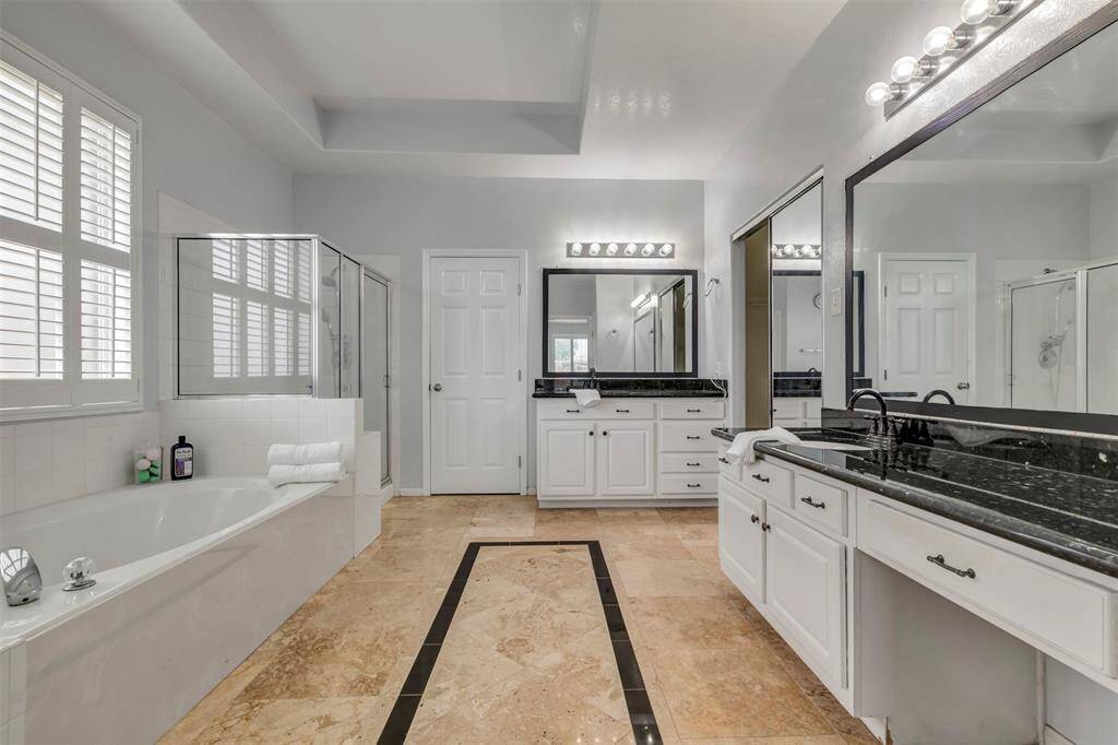 Your own home spa awaits you after a long day at work! Soak and relax in the garden tub. Separate shower for the morning showers, His and Hers vanities and 2 large closets.