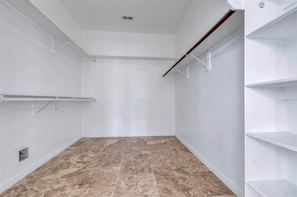 One of the primary closets. Build-in shelf to store all your shoes and purses!