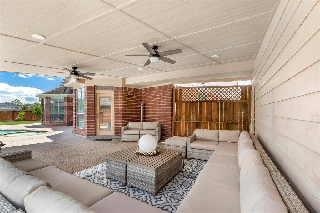 Plenty of space to entertain or just relax under this oversized and covered backyard. The 2 fans will offer a nice breeze. So what are you waiting for? Time to put those burgers on the grill! This can be yours just in time for 4th of July!