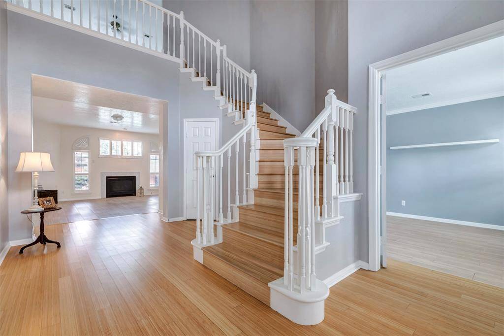 Elegant, spiral staircase welcomes you upon entering the home.