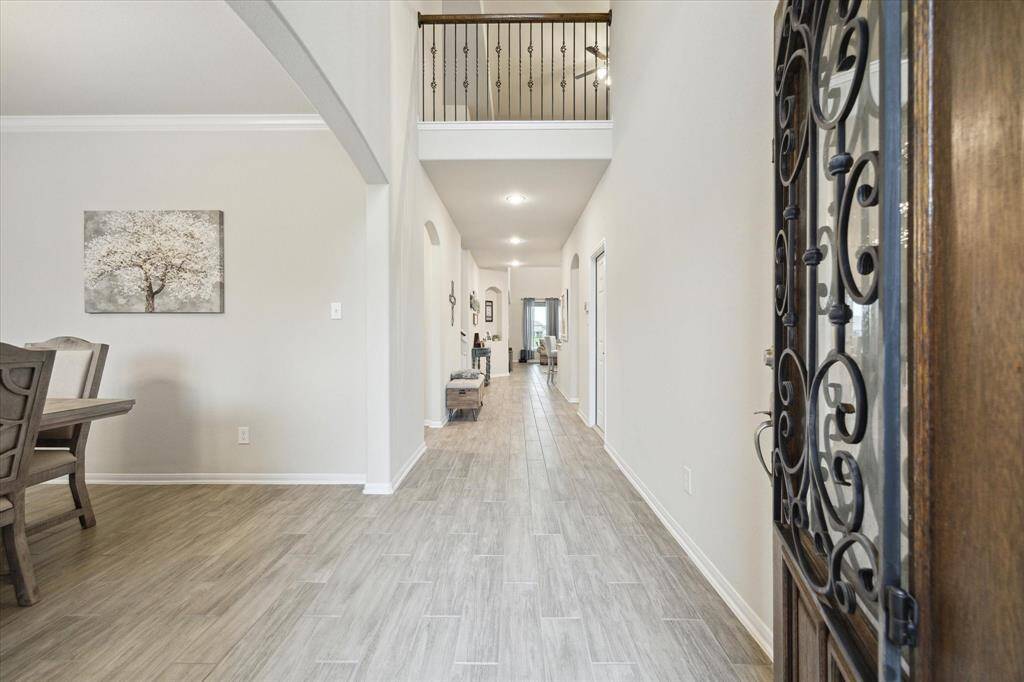 A look back from the end of the hall to front door, nice and wide as well.