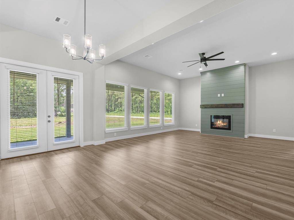 True open concept layout with the dining space separating the family room and kitchen