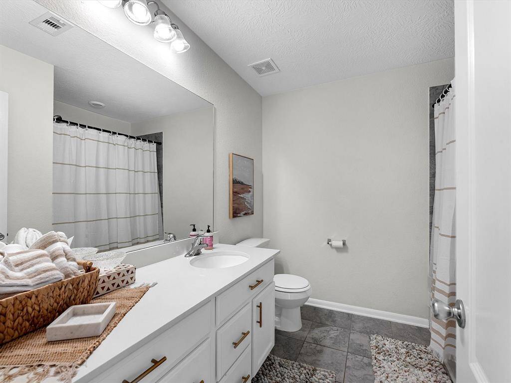 Clean, Convenient & Stylish! A full bath designed for ease and everyday living.