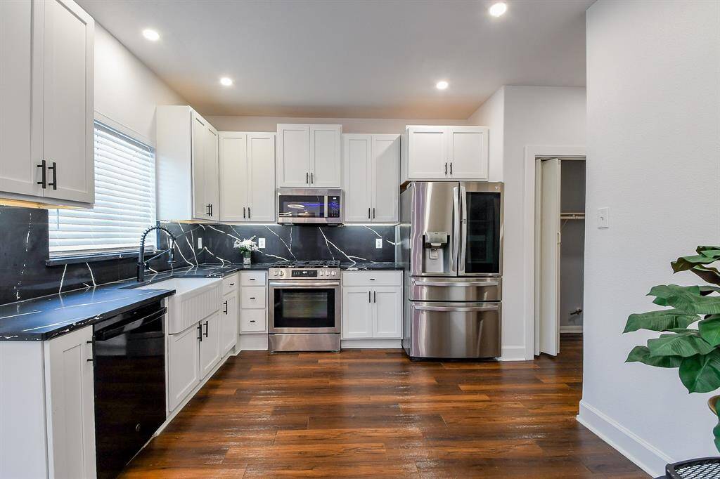 White cabinets and stainless steel appliances in the modern kitchen!