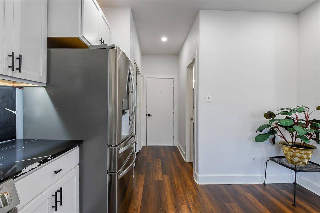 View to the garage door and the half bath on the right!
