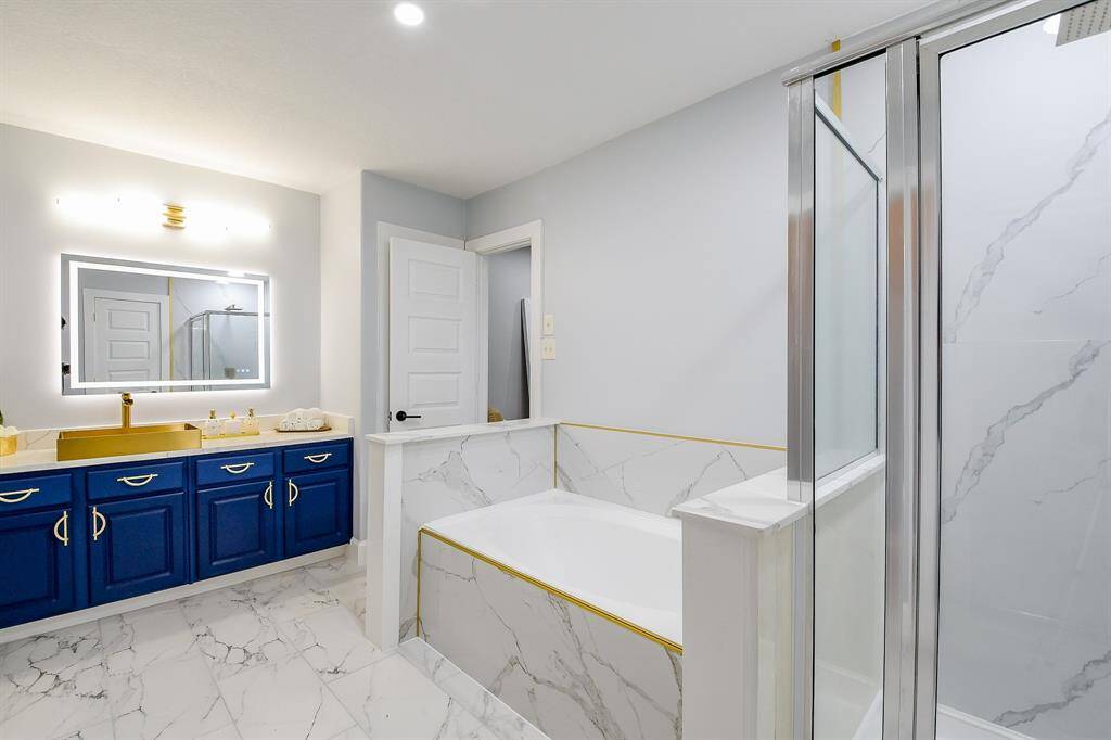 Bathtub and a separate standing shower in the primary bathroom!