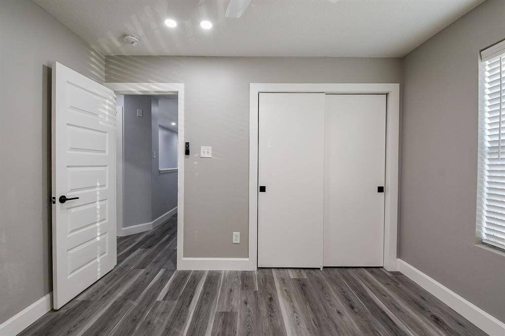 This 3rd  bedroom also features recessed lighting and a ceiling fan!