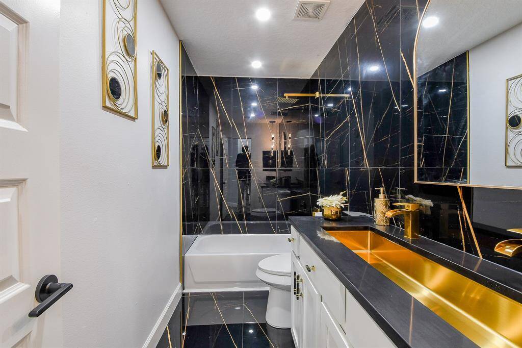 Stunning secondary bathroom located between the third and fourth bedrooms!