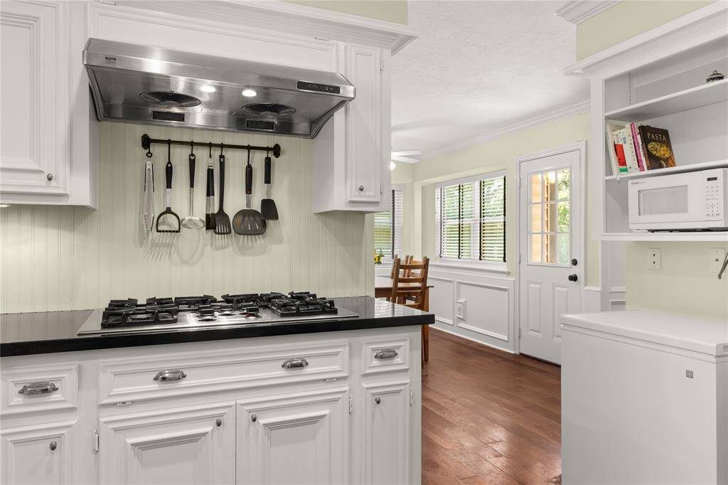 Kitchen opens to breakfast area and formal dining