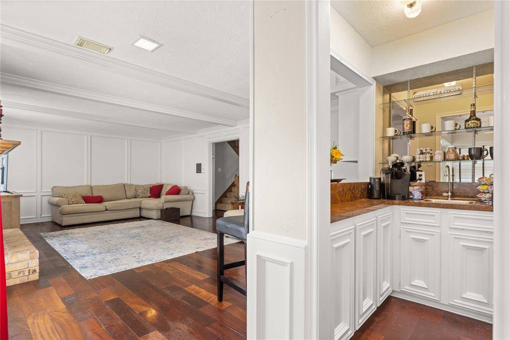 Wet bar or cute coffee bar opens to breakfast room and living room