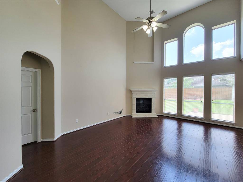 Cast-Stone Fireplace with art niche is the focal point of this room.