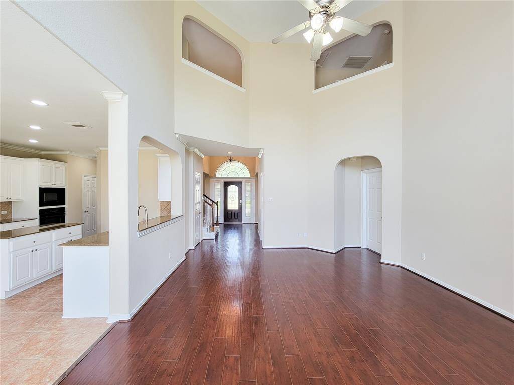 Open layout leading to the Kitchen/Breakfast area on the left-side.