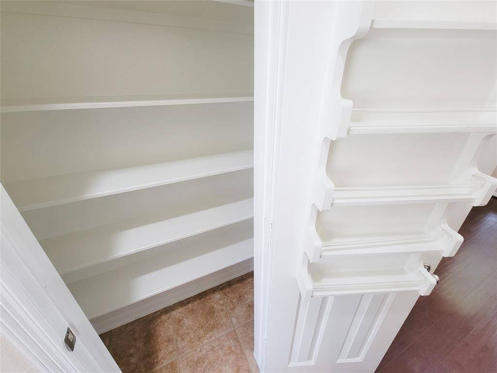 Additional second pantry with spice rack.
