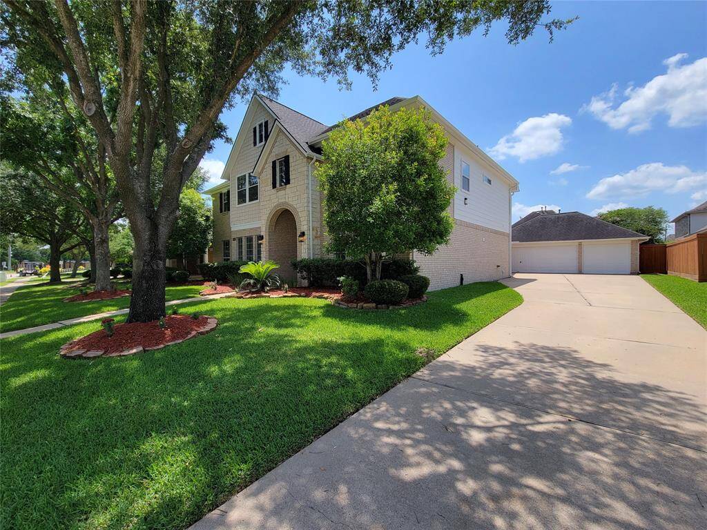 Side view. Note the long driveway, leading to 3 car detached Garage Comes in handy when you have company.